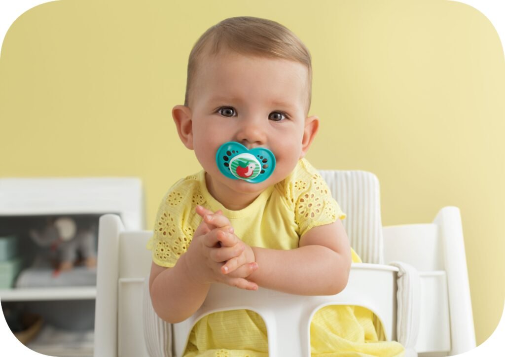 A baby sucking on a pacifier