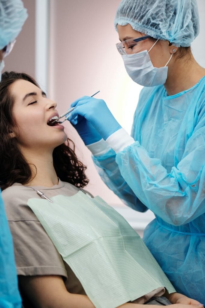 a dentist checking the woman s teeth